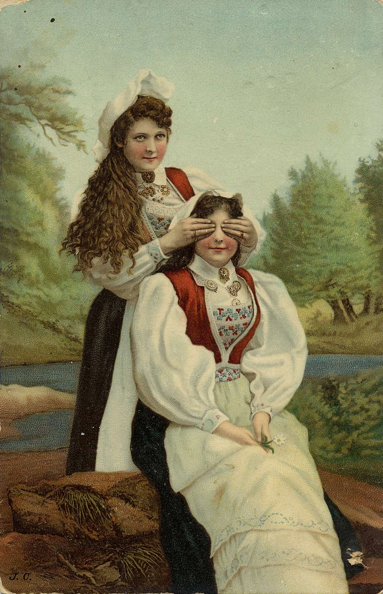 Jule- og nyttårskort. Sommermotiv.  To kvinner i folkedrakter sitter ved et vann. Den ene kvinnen holder hendene over øynene på den andre. Datert julen 1902-1903.