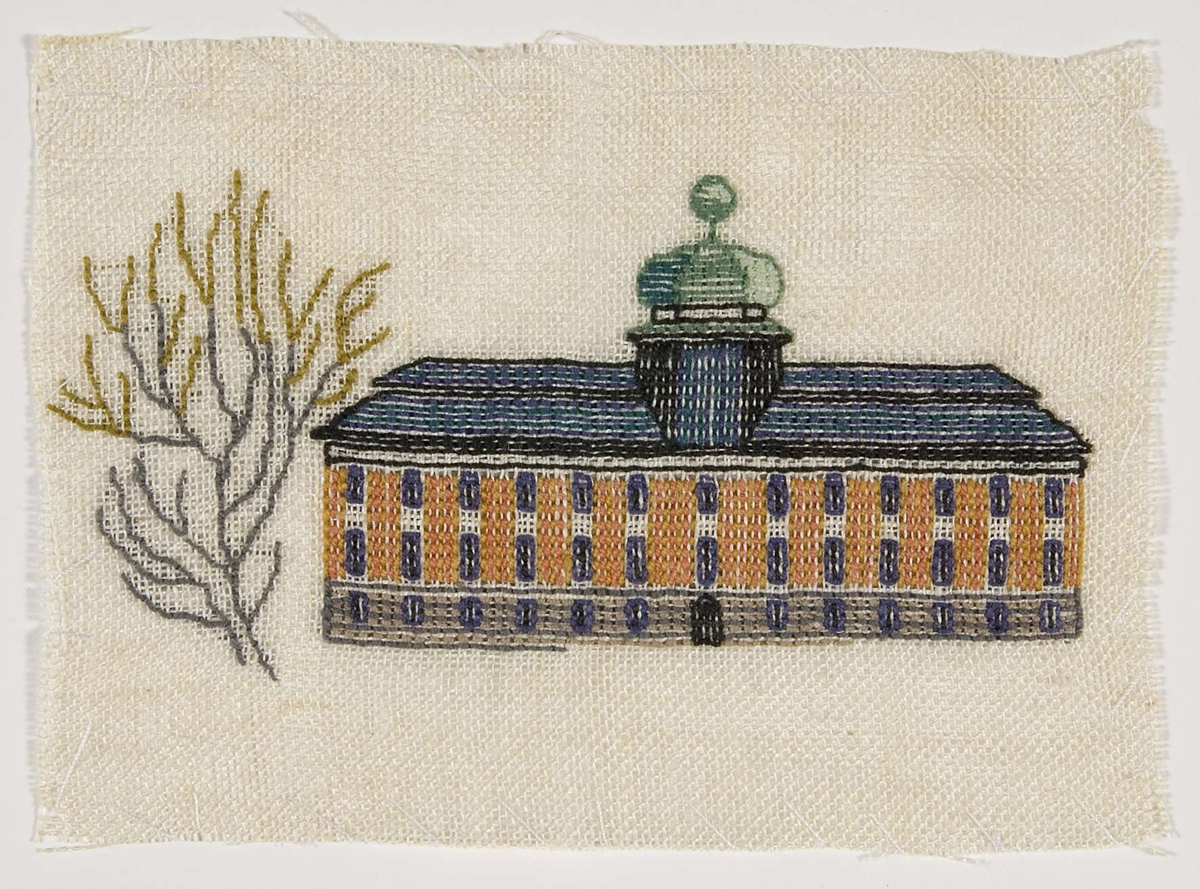 En broderad bild med Gustavianum, Uppsala som motiv.