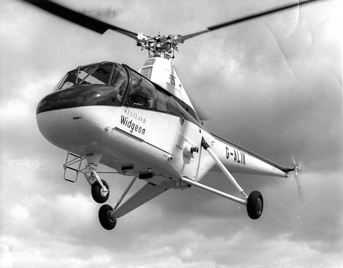Luftfoto. Ett helikopter i luften, Westland Widgeon G-ALIX.