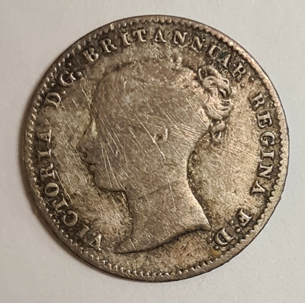 2 mynt från Storbritanien.
3 Pence, 1861