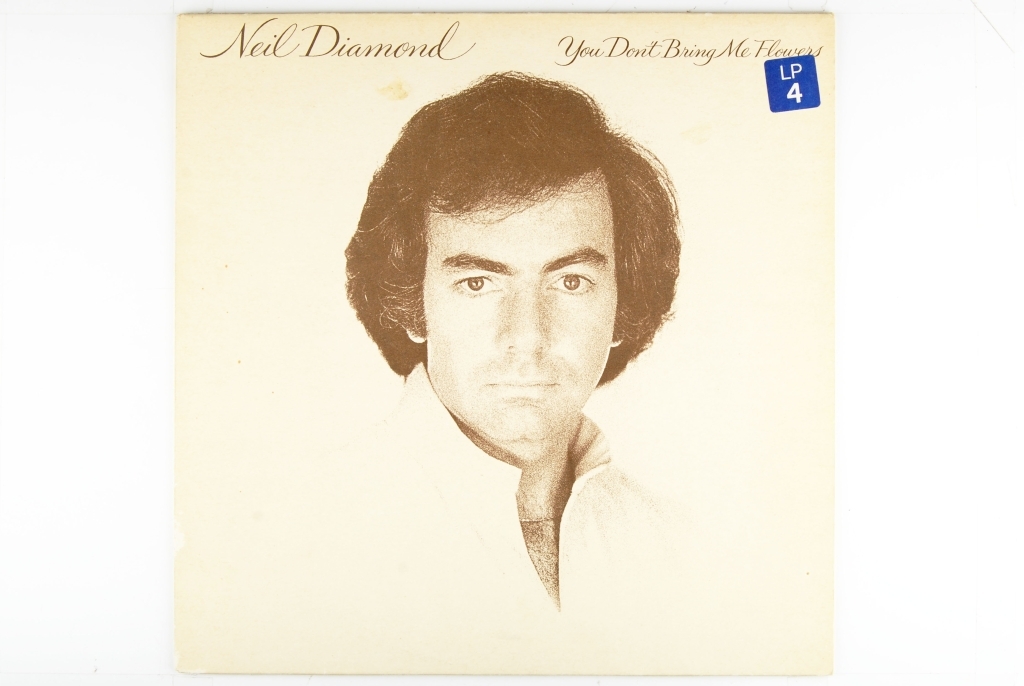 Portrett av Neil Diamond på forsiden av coveret.