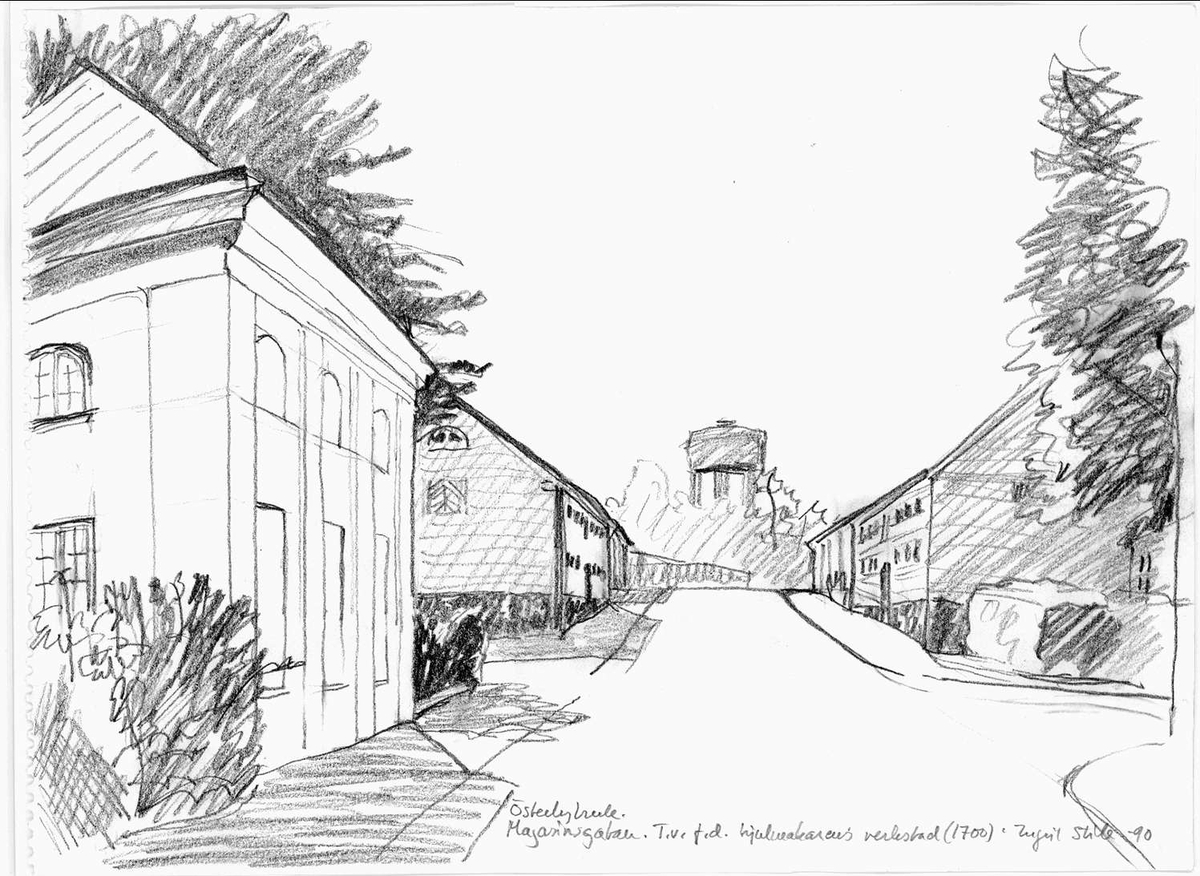 Bruksgata kantad av träd mellan bebyggelse och verkstäder vid Österbybruks herrgård. I bakgrunden skymtar ett vattentorn.