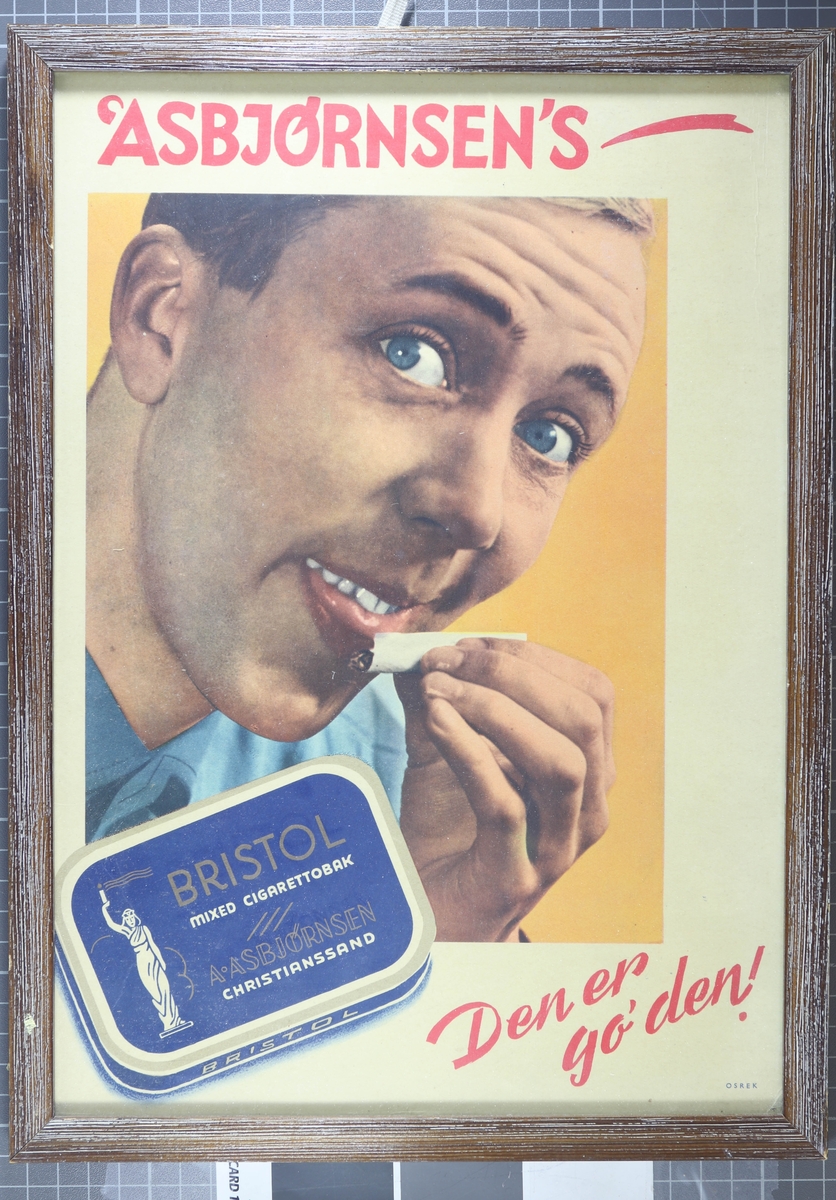 Boks med Bristol tobakk foran mann som slikker sigarettpapir. Under står teksten "Den er go'den!"
