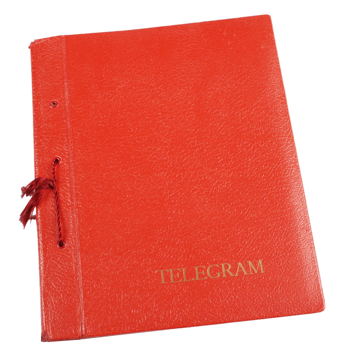 Telegrampärm. Pappband klätt i rött konstläder. Präglat "TELEGRAM" i guldtryck längst ned. Innehåller 19 telegram. De flesta maskinskrivna med olika dekor, från åren 1945-1947. Bundna till pärmen med rött snöre. I gott skick.