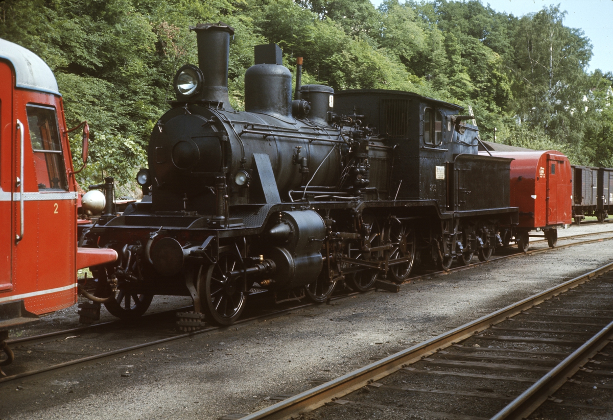 Damplokomotiv type 21a nr 203 hensatt på Arendal stasjon. Lokomotivet ble tatt ut av drift etter Treungenbanens nedleggelse høsten 1967