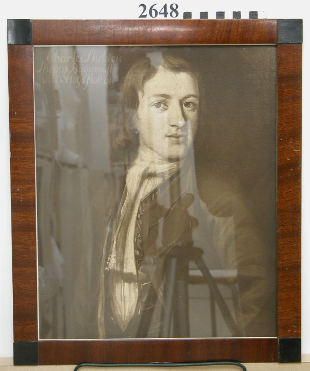 Fotografi i glas och ram av porträtt av skeppsbyggmästare Charles Sheldon.