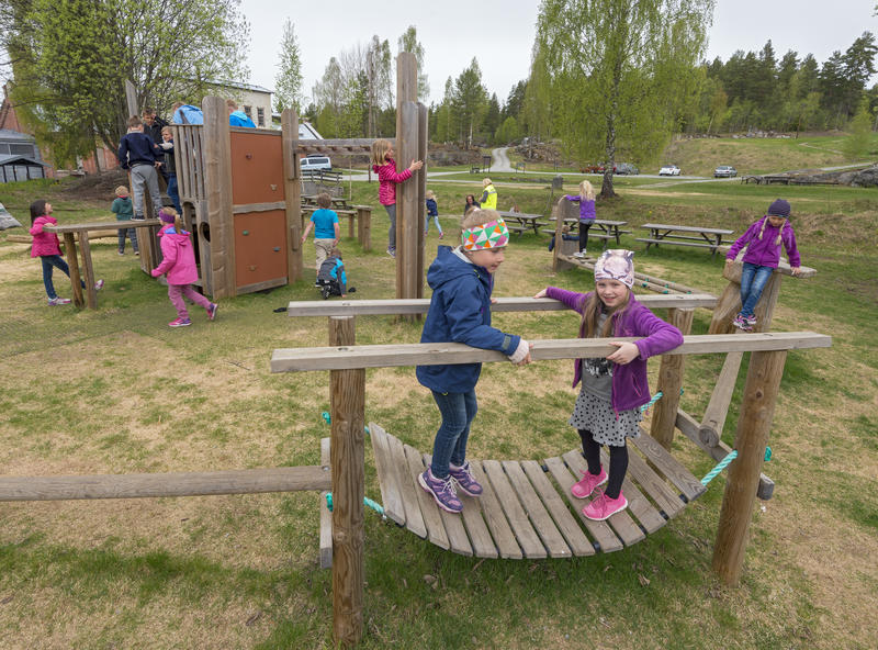 Children play in the playground outside the museum.