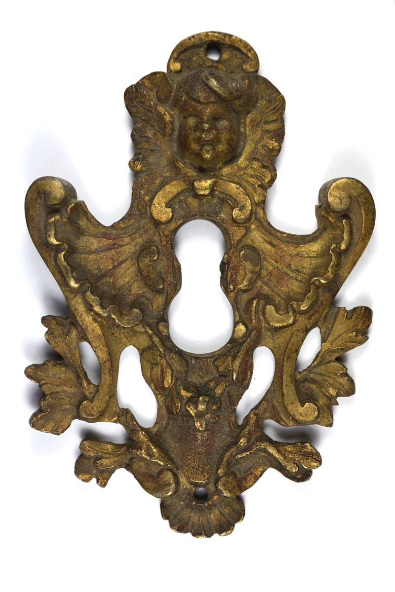Nyckelbeslag av brons i rokokoform.