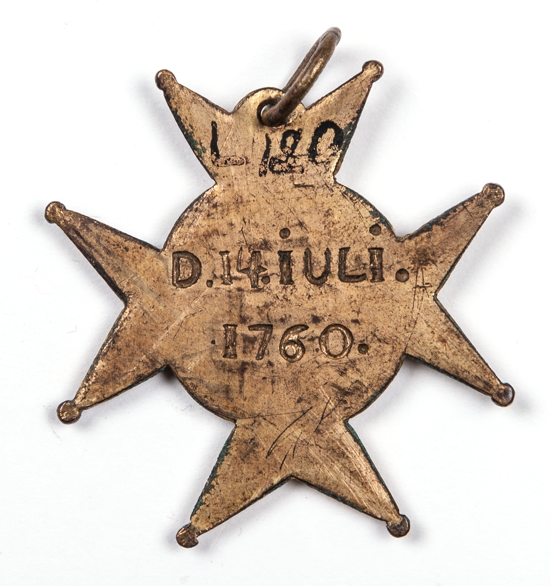 Ordenstecken för Amaranterorden, av förgylld mässing. Stjärnformigt, märkt med olika tecken. På baksidan märkt: "D. 14. JULI.1760"