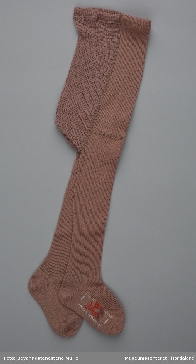 Gammalrosa barnestrømpebukse i ull og nylon, i merket Janus.