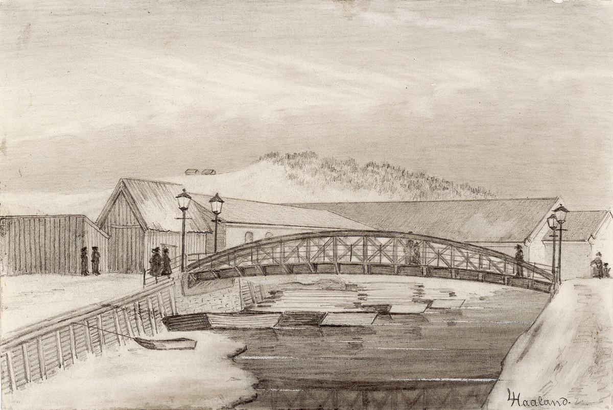 Vinterbilde. Sett ovenfra mot broen. På denne går tre personer- På venstre side ligger store pakkhus. I bakgrunnen Ekebergåsen.