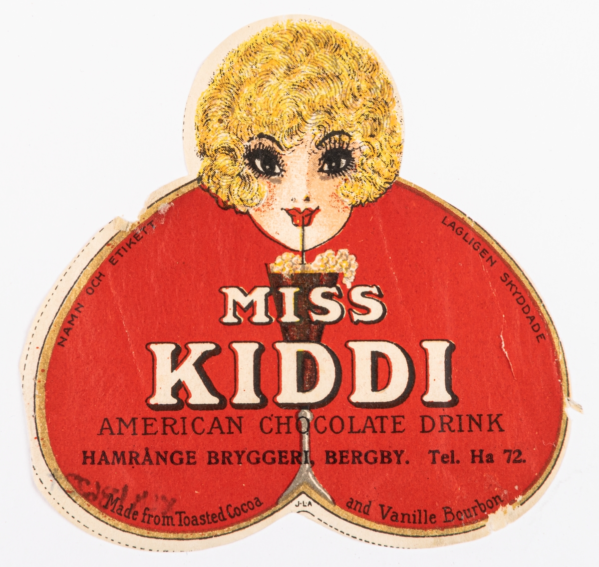 Etikett för flaska. Miss Kiddi - american chocolate drink.
Hamrånge bryggeri, Bergby.