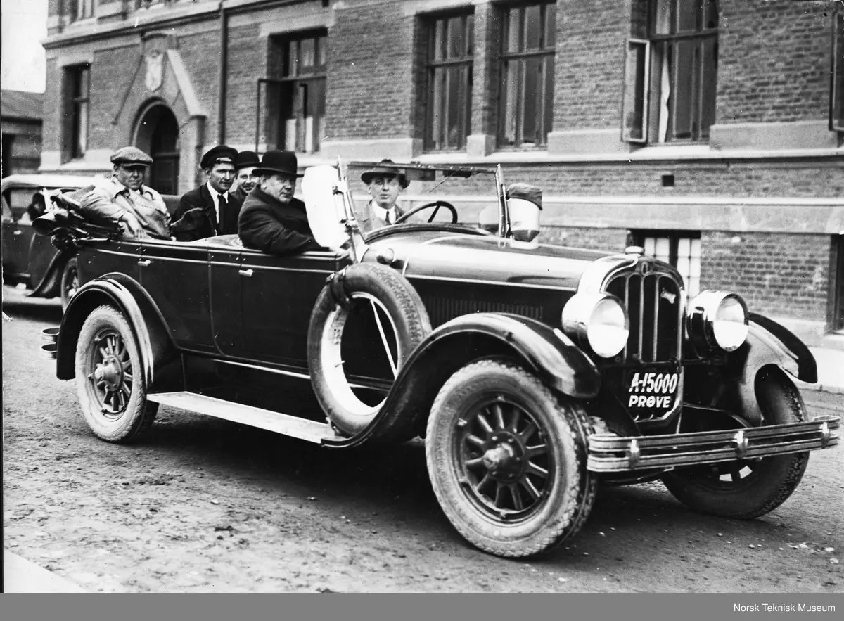 Ralphie Parker, played by Peter Billingsley, sits in the backseat of a car with his father, Chandler, and uncle John Erik Isberg, in a scene from A Christmas Story, 1920s-style.