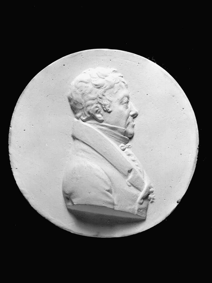 Medaljong, avgjutning i gips, över Vilhelm Hisinger, f. 1766, d. 1852. Höger profil. Tjocklek 10 mm.