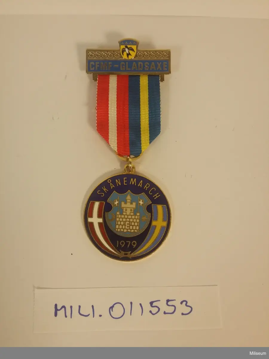 Medalj från CFMF Gladsaxe (Danmark) för "Skånemarch" 1979, av emaljerad och förgylld mässing.