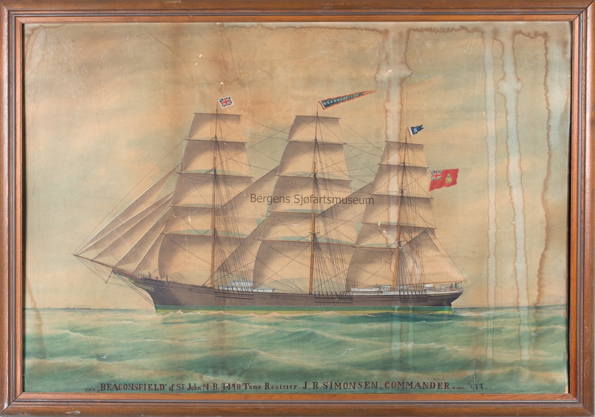 Skipsportrett av fullrigger BEACONSFIELD under fulle seil. Fører det Kanadiske flagg på mesangaffelen samt Union Jack på fortoppen og vimpel med skipets navn i stormasten. .