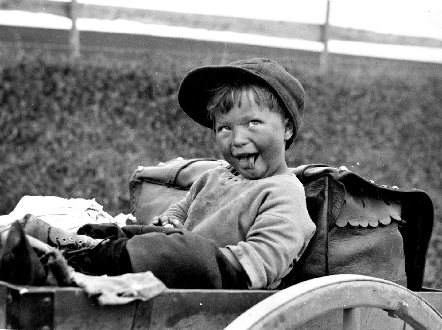 Traveler boy in a cart.