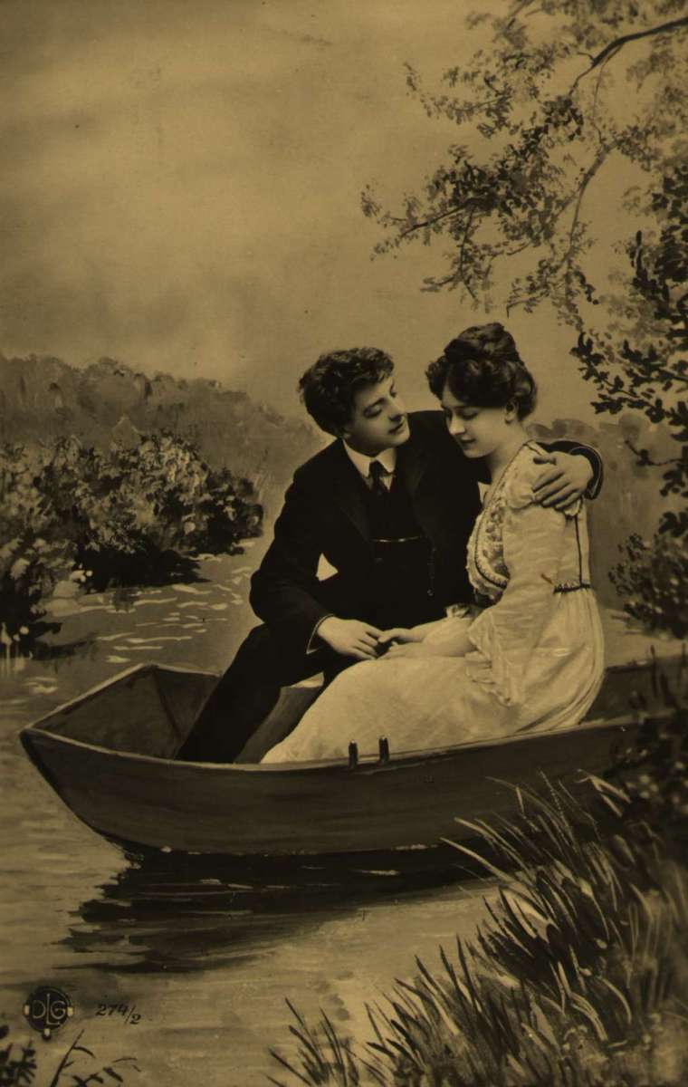 Postkort. Nyttårshilsen. Et par sitter i en robåt. Kurtisekort. Stemplet 31.12.1906